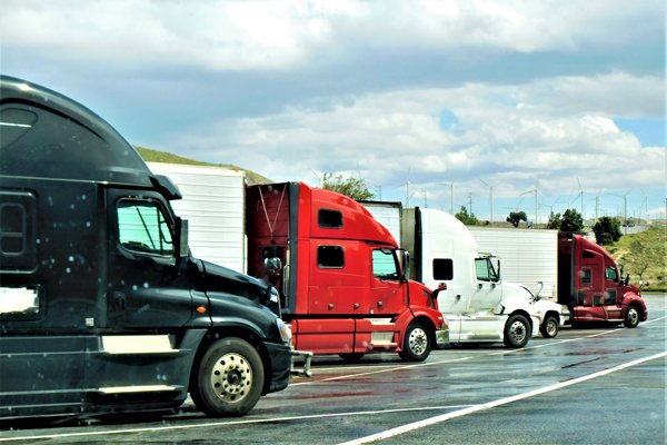 a group of trucks parked and ready to ship off